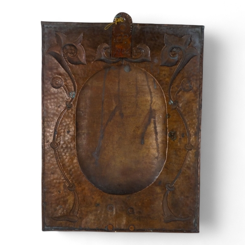 18 - A fine copper twin branch wall sconce by John Pearson - rectangular with foliate repousse decoration... 