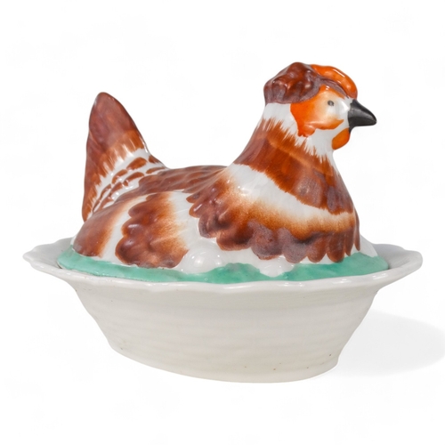 204 - A late 19th century French egg crock - modelled as a hen and polychrome painted, 18cm wide.