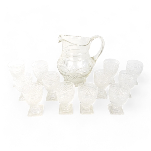 205 - A harlequin set of twelve clear cut glass sherry glasses - hobnail cut with a foliate band and raise... 