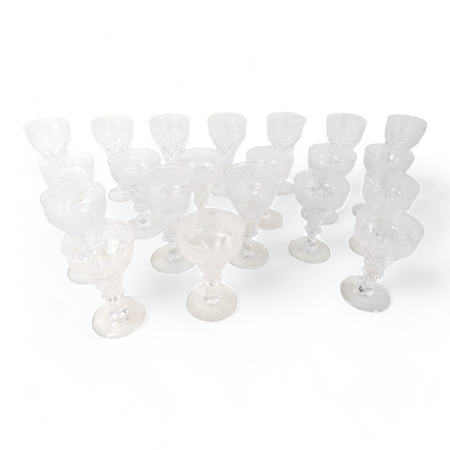 206 - A  set of twelve sherry glasses - clear cut glass faceted with an etched band of vines, 10cm high, t... 