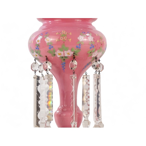 215 - A pair of Victorian pink glass table lustres - decorated with floral swags and clear glass drops, 32... 