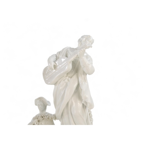 216 - A Meissen blanc de chine figure group - surmounted by a woman with guitar and figures below with flo... 