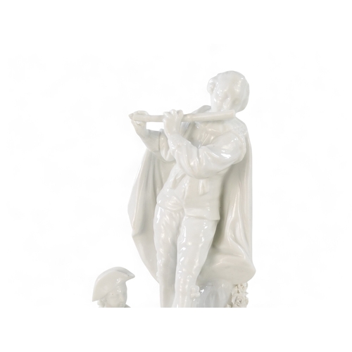 216 - A Meissen blanc de chine figure group - surmounted by a woman with guitar and figures below with flo... 