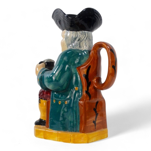 220 - An early 20th century Woods style Toby jug - wearing a green jacket and red breeches, 32cm high.