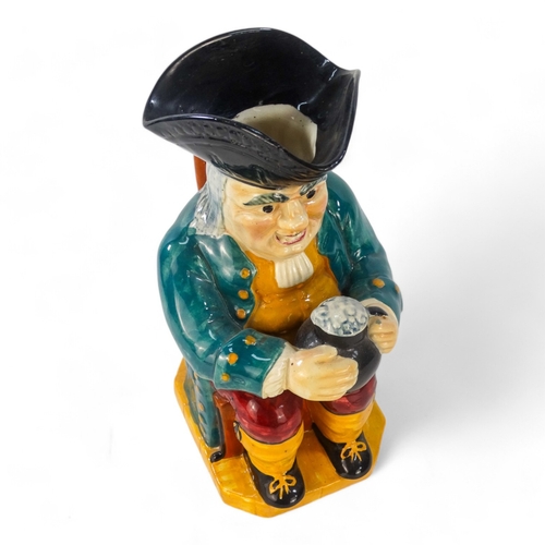 220 - An early 20th century Woods style Toby jug - wearing a green jacket and red breeches, 32cm high.