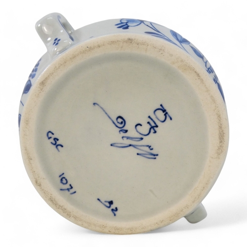 221 - A 20th century Delft part coffee service - comprising a rectangular tray, a small jug, a sucrier and... 