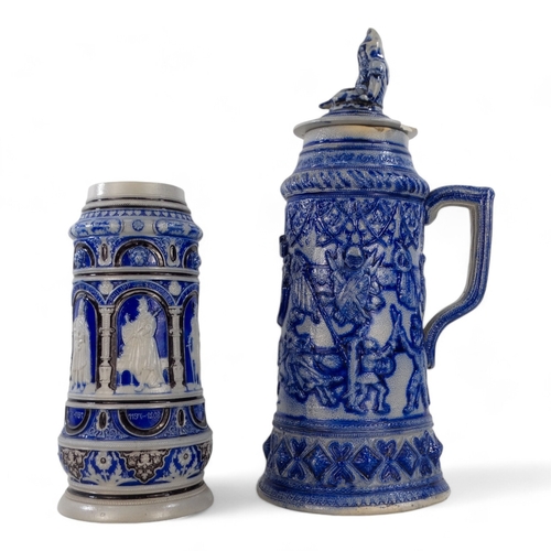 226 - An early 20th century German salt glazed tankard - blue and grey decorated with images of German cro... 