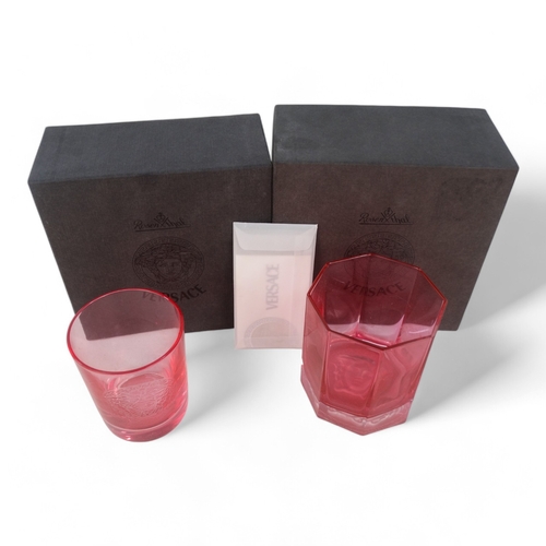 228 - Versace for Rosenthal whisky glass - of pink faceted form with impressed Medusa head to base, boxed ... 