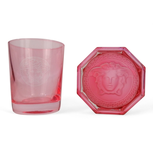 228 - Versace for Rosenthal whisky glass - of pink faceted form with impressed Medusa head to base, boxed ... 