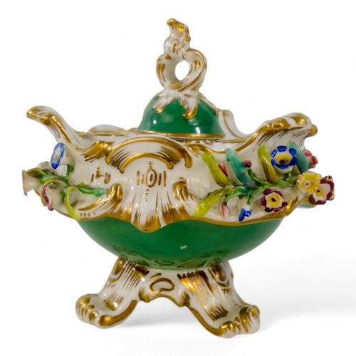 238 - A 19th century Coalport inkwell - encrusted with flowers and gilt foliage, on an apple green ground,... 