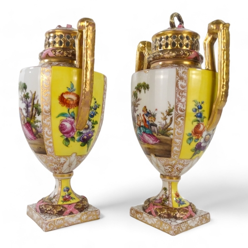 239 - A pair of Dresden vases - with reticulated covers and twin handles, painted with figures in a landsc... 