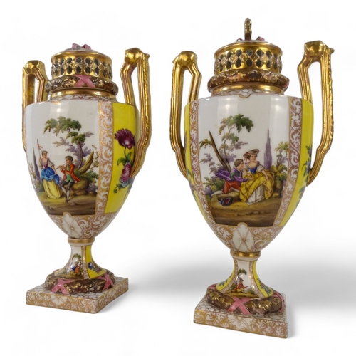 239 - A pair of Dresden vases - with reticulated covers and twin handles, painted with figures in a landsc... 