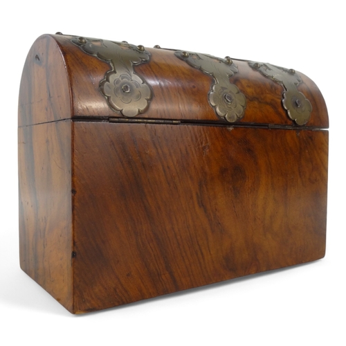 24 - A Victorian walnut stationery casket - with pierced and engraved brass mounts, 23cm wide.