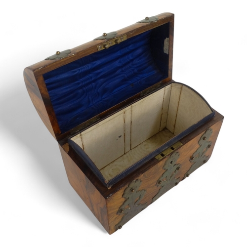 24 - A Victorian walnut stationery casket - with pierced and engraved brass mounts, 23cm wide.