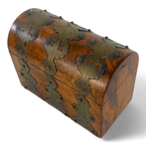 24 - A Victorian walnut stationery casket - with pierced and engraved brass mounts, 23cm wide.