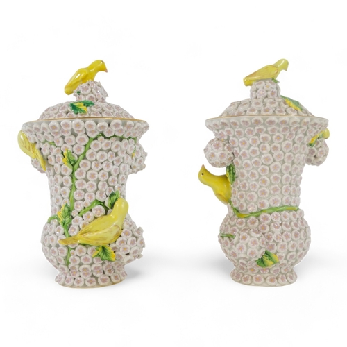 240 - A pair of Meissen style flower encrusted vases - of baluster form with yellow birds, 18cm high. (2)