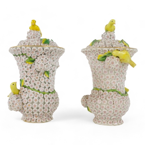 240 - A pair of Meissen style flower encrusted vases - of baluster form with yellow birds, 18cm high. (2)