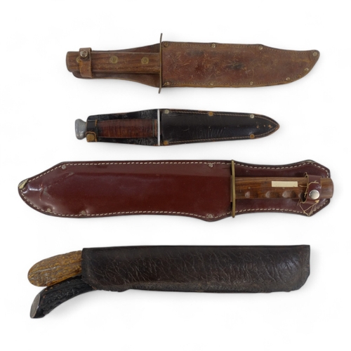 25 - A 20th century Bowie knife - Solingen Germany, with a walnut handle, within a brown leather scabbard... 