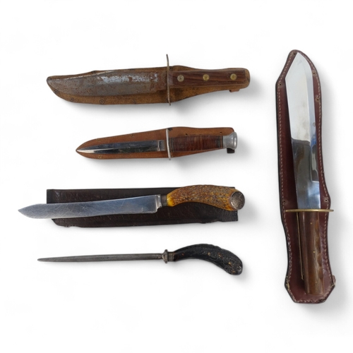 25 - A 20th century Bowie knife - Solingen Germany, with a walnut handle, within a brown leather scabbard... 