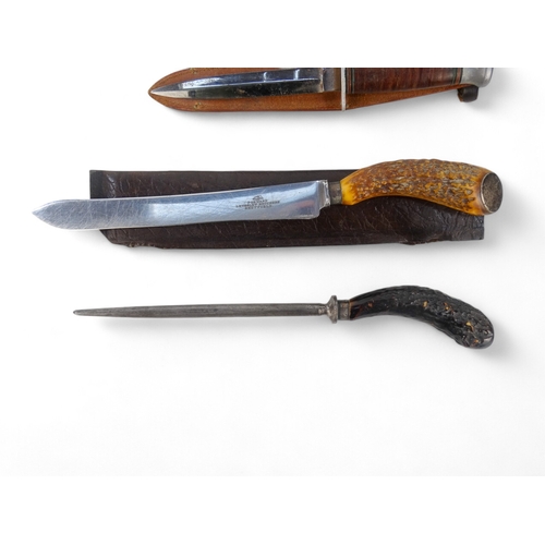 25 - A 20th century Bowie knife - Solingen Germany, with a walnut handle, within a brown leather scabbard... 