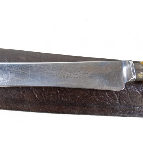 25 - A 20th century Bowie knife - Solingen Germany, with a walnut handle, within a brown leather scabbard... 