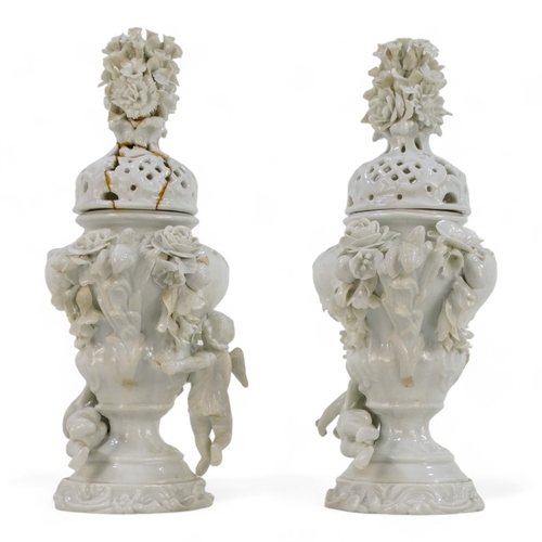 256 - A pair of 19th century Volkstedt lidded vases - the reticulated covers with floral knops, the squat ... 