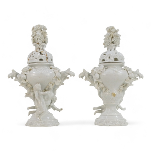 256 - A pair of 19th century Volkstedt lidded vases - the reticulated covers with floral knops, the squat ... 