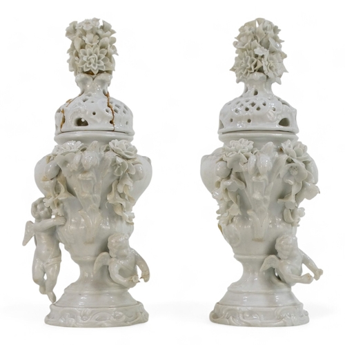 256 - A pair of 19th century Volkstedt lidded vases - the reticulated covers with floral knops, the squat ... 