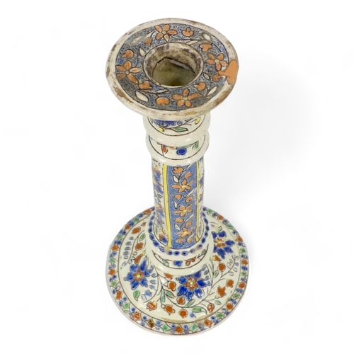 271 - A pair of early 20th century Iznik style candlesticks - decorated with trailing flowers on a cream g... 