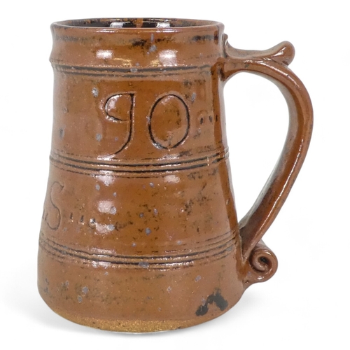 275 - A William (Bill) Marshall tenmoku glazed tankard - dated 1990 with ownership initials and bearing po... 