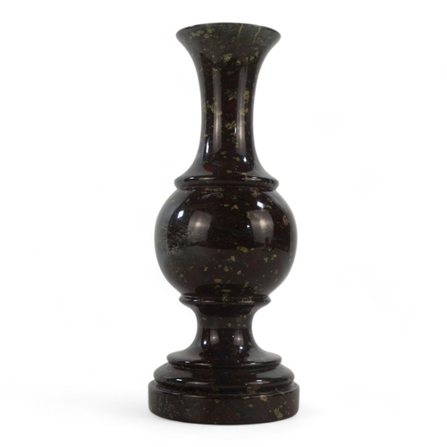 28 - A 20th century serpentine lamp base - of turned baluster form, 27cm high.