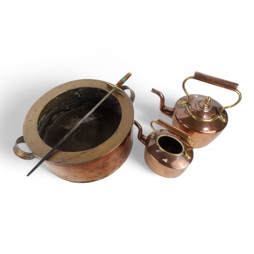 29 - A large copper pan - circular with twin handles 39cm diameter, together with two late 19th century k... 