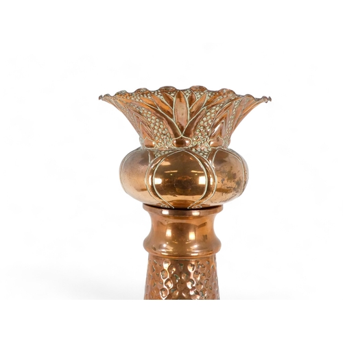 36 - A late 19th century copper jardiniere and stand - decorated in the Art Nouveau style, the bowl with ... 