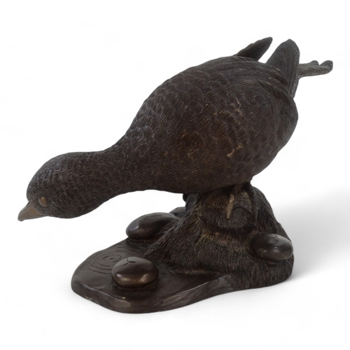 39 - A cold cast bronze model of a duck - signed M Jandy to base, 21cm wide.