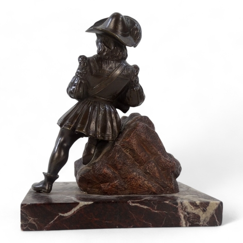 49 - A bronze modelled as a Dutch falconer - kneeling on a pile of rocks and mounted on a marble base, he... 