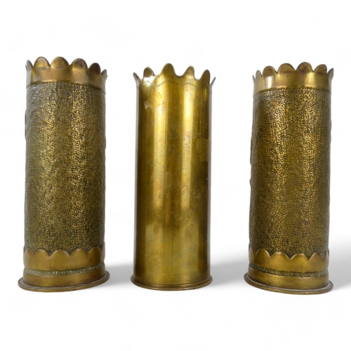 52 - Three WWI Trench Art shell cases - two with floral decoration and one inscribed 'Verdun 1916', heigh... 