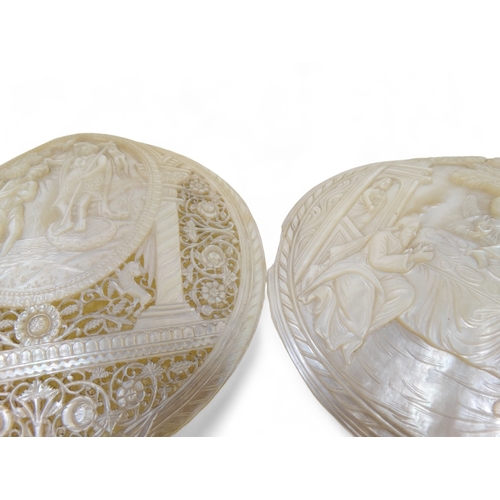 53 - Two Jerusalem carved mother of pearl religious shell tokens - pierced and decorated with Christian i... 