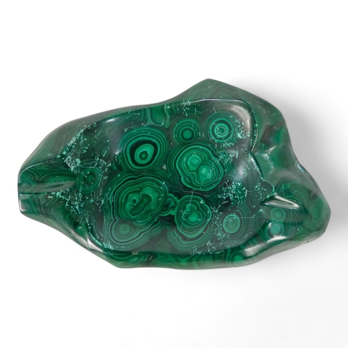 63 - A large malachite ashtray - of amorphous form, 5.4kg, together with a sample of quartz (2)