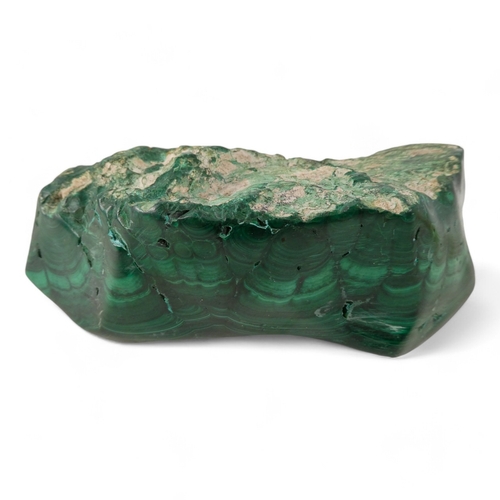 63 - A large malachite ashtray - of amorphous form, 5.4kg, together with a sample of quartz (2)