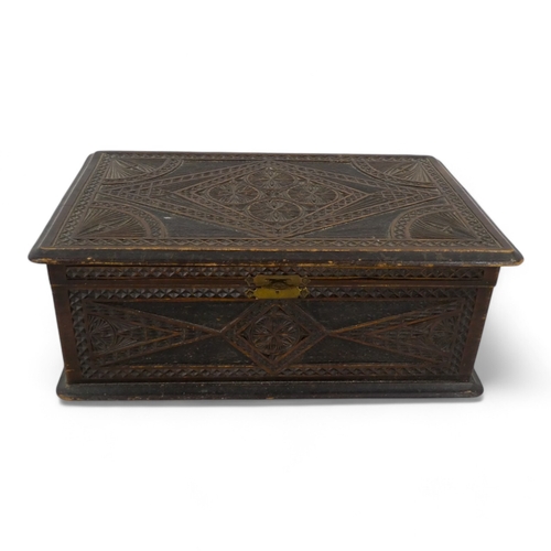 66 - A late 19th century carved box - decorated with a geometric pattern, 30cm wide, together with two Ma... 