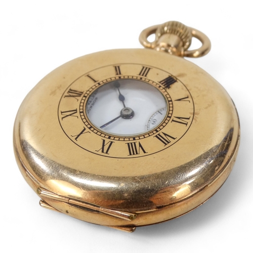 702 - A gold plated half hunter pocket watch by James Walker Ltd., - the white enamel dial set out with Ro... 