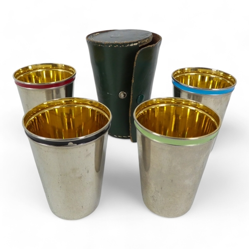 71 - A set of four stainless steel travel beakers - in a pig skin holder, together with five other groups... 