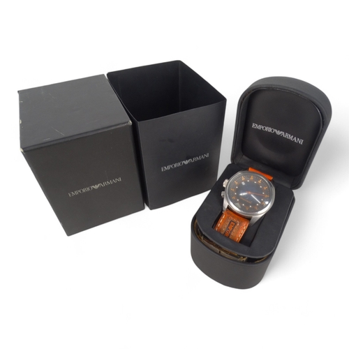 714 - An Emporio Armani gentlemans wristwatch - steel case, black dial and orange numerals and strap, boxe... 