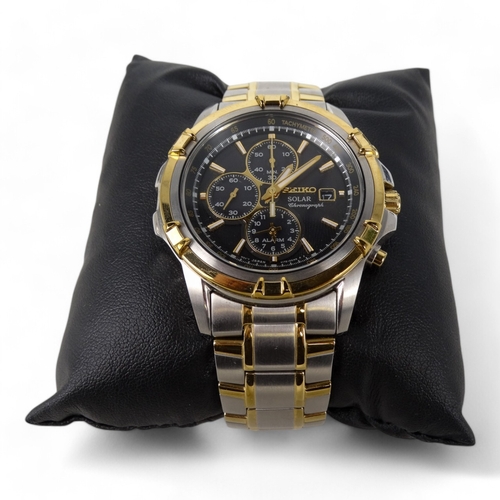 716 - A Seiko gentlemans chronograph wristwatch - steel case and strap, the black dial with baton numerals... 