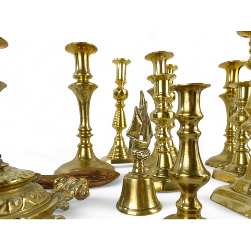 8 - Four 19th century brass candlesticks - of baluster form raised on circular bases, 23cm high, togethe... 