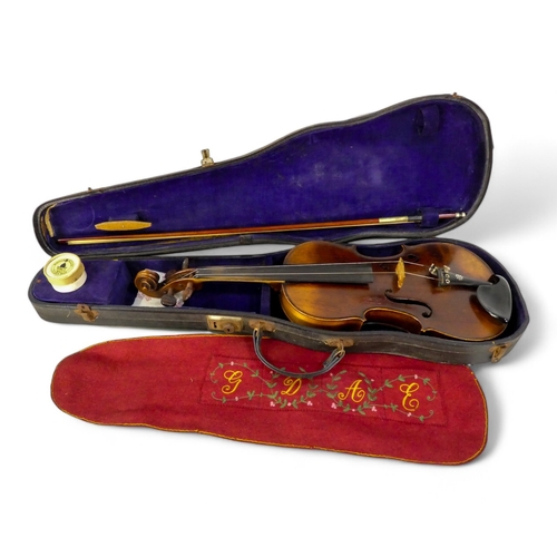 89 - A 19th century German violin - with a single piece back, 60cm, together with a hardcase and bow.