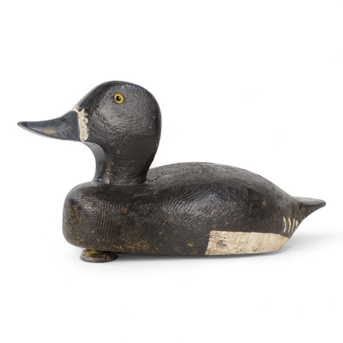 9 - An early 20th century polychrome painted decoy duck - with yellow beaded eyes and lead weight to bas... 