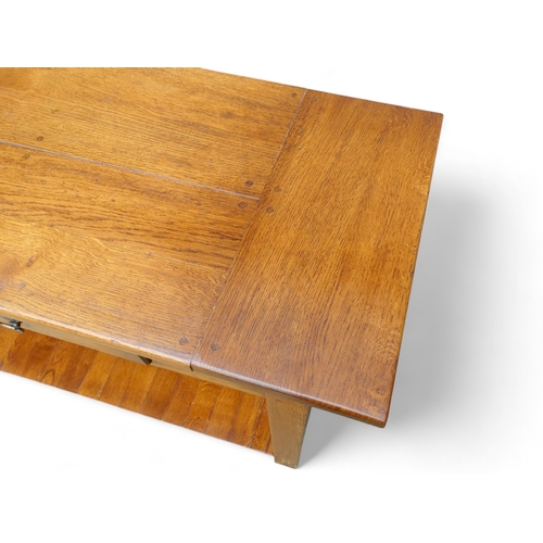 950 - A 19th century style serving table - the cleated plank top above two frieze drawers, on square taper... 