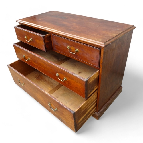 955 - An Edwardian mahogany chest of drawers - the rectangular top above an arrangement of two short and t... 