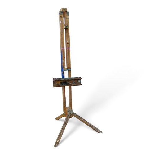 957 - A 20th century beech artist's studio easel - of folding tripod form with some paint transfer, fully ... 